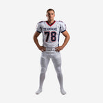 Football uniforms for clubs in white and navy with red trim V-neck and dual leg stripe, front view of full set