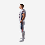 Right side view of white navy and red sublimated football uniform for clubs showing sleeve number and pant stripe detail