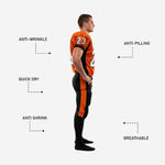 Back view of custom orange and black American football uniform for leagues showing back number nameplate area and black football pants with orange side stripe