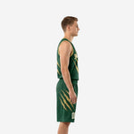 Side view of custom forest green basketball uniform showing gold claw motif on shorts leg and sleeveless jersey silhouette