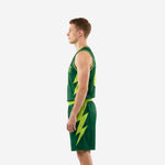 Side view of custom forest green basketball uniform showing full lightning bolt side panel graphic on jersey and shorts