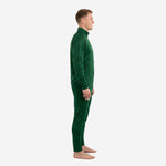 Forest green custom soccer tracksuit left side view showing raglan sleeve construction and tapered pant leg with zipped ankle