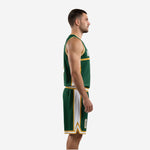 Left side view of forest green and athletic gold sublimated basketball uniform showing arrowhead shorts panel detail