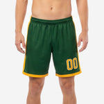 Forest green soccer shorts with Athletic Gold side panels and player number 00 on the left leg, front view on adult male model