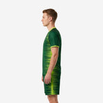 Right side view of men's custom soccer uniform kits for teams in forest green and lime green with athletic cut and breathable construction