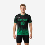 Mens forest print green soccer training jersey with jet black body and kelly green gradient hem worn by adult male model front view