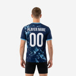 Full-dye sublimated blue soccer training jersey Navy and Ice Blue shard graphic running edge to edge from collar to hem, front detail