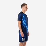 Custom blue soccer uniform with electric blue lightning sublimation, left side view showing jersey and matching shorts