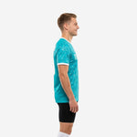 Custom dye sublimated training jersey in teal white splash, left side view showing short sleeve and white cuff trim