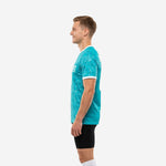 Custom dye sublimated training jersey in teal white splash, right side view showing athletic cut and back number print