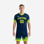Full print custom men's soccer uniforms in Navy Blue and Neon Yellow gradient, front view showing team name and number on jersey and matching shorts
