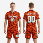 Athletic Orange camo soccer uniform with teal vertical stripe on shorts outer seam, close side view