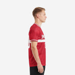 Custom red soccer shirt crimson and white left side view showing short sleeve cuff trim and vertical white stripe detail