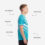 Back view of full print custom soccer tops in teal and white with player name and number print zones