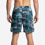 Right side view of grey and cyan camo basketball shorts showing continuous sublimation design and open hem split
