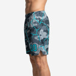 Left side view of custom grey camo basketball shorts with cyan crack-line sublimation print across the full panel