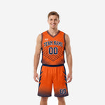 Full sublimation basketball uniforms in orange and navy chevron stripe design shown as a complete two-piece jersey and shorts set on a male model, front view