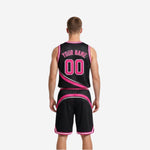 Black reversible basketball uniforms side view showing armhole binding and shorts side panel swoosh detail