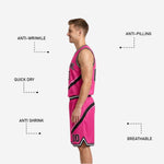 Close detail of diagonal swoosh graphic sublimated print on black and pink reversible basketball jersey front panel