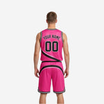 Pink reversible basketball uniforms side view showing black trim armhole binding and shorts side panel swoosh detail