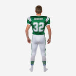 Youth football uniform set side view showing green jersey shoulder stripes, set-in sleeve with white binding, and full-length white pant with green leg stripe detail
