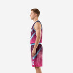 Galaxy pink basketball uniforms side view showing sky blue armhole binding and matching shorts with elastic waistband