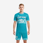 Men's custom teal and white geometric band soccer team uniform set, front view showing team name and number on jersey with matching shorts