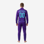 Close front detail of geometric diamond sublimation print on Royal Purple custom soccer tracksuit jacket with Turquoise crest placement