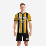 Custom gold and black pinstripe soccer uniform for teams, front view with team name and number