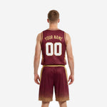 Opposite side view of custom burgundy basketball uniforms showing full gold side panel detail on jersey and shorts, athletic cut for adult players