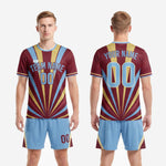 Back view of custom men's soccer team uniforms in maroon with player name and number printed on the rear panel in powder blue