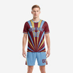 Front view of gold trim custom men's soccer team uniforms in maroon with powder blue sunburst rays and matching powder blue shorts