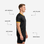 Close detail of Athletic Gold cuff trim on black short-sleeve mens soccer training jersey showing colorfast sublimation finish
