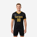 Gold trim custom mens soccer training jersey in jet black with Athletic Gold team name and number printed on the front chest