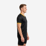 Full-body front view of black and Athletic Gold custom mens soccer training jersey with team name and squad number placement
