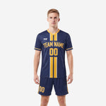 Gold trim custom soccer uniform kits for teams in navy blue, front view showing athletic gold center stripe and team name print on adult male model