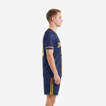 Custom soccer uniform kits for teams navy blue and athletic gold, left side view showing gold sleeve trim and matching shorts side stripe