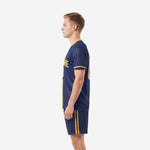 Navy blue custom soccer uniform kits for teams with athletic gold trim, right side view showing double gold stripe on shorts and jersey hem