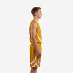 Front view of gold youth basketball uniform with white diagonal panel, arced team name across chest, and centered number 24 in white with purple outline
