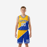 Gold youth basketball uniforms with royal blue diagonal color-block jersey and matching shorts, white V-notch trim, arched team name and number 00 on front