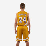 Opposite side view of gold and white youth basketball uniform showing consistent white wave panel detail on shorts and jersey