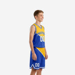 Side view of custom gold and royal blue youth basketball uniform set showing diagonal panel design on both jersey and shorts