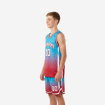 Opposite side view of custom teal youth basketball uniform set showing gradient fade from teal shoulders to red hem on shorts