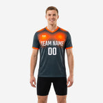 Front view of custom graphite and orange gradient mens soccer training top with white team name and number printed on chest