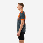 Right side view of gradient mens soccer training top in graphite and orange showing set-in sleeve and V-neck collar trim