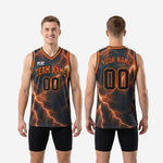 Close detail of the orange lightning graphic and V-neck binding on the charcoal gray sublimated basketball jersey for travel teams
