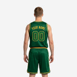 Close detail of green and gold basketball jersey showing sublimated gold arched lettering and outlined front number on forest green performance knit fabric