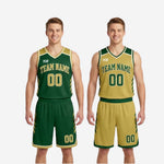 Close-up detail of the green and gold reversible basketball jersey showing V-neckline contrast binding, slash accents, and sublimated team name and number