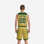 Opposite side view of the green and gold reversible basketball uniform displaying contrast trim binding on armholes and side panel detailing