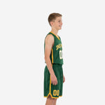 Side view of custom green and gold youth basketball uniform showing gold armhole binding and side panel stripe on jersey and shorts